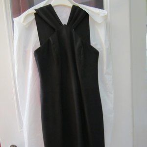 Classic women's little black dress, zippered, mid-length, with small back slit